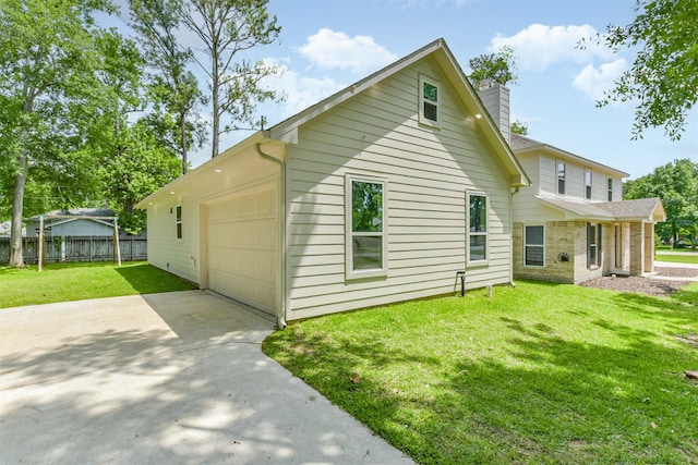 3626 Lake Breeze Ln, Crosby, TX 77532 - back of property with a chimney, fence, a yard, an attached garage, and driveway