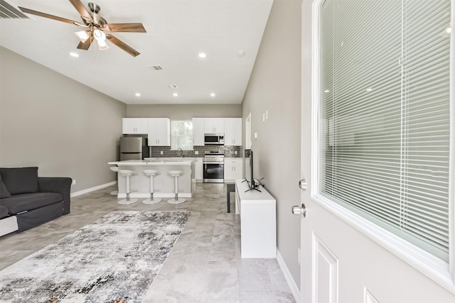 3626 Lake Breeze Ln, Crosby, TX 77532 - living area with recessed lighting, marble finish floor, visible vents, baseboards, and ceiling fan