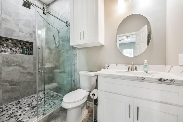 3626 Lake Breeze Ln, Crosby, TX 77532 - full bathroom with vanity, toilet, a stall shower, and ceiling fan