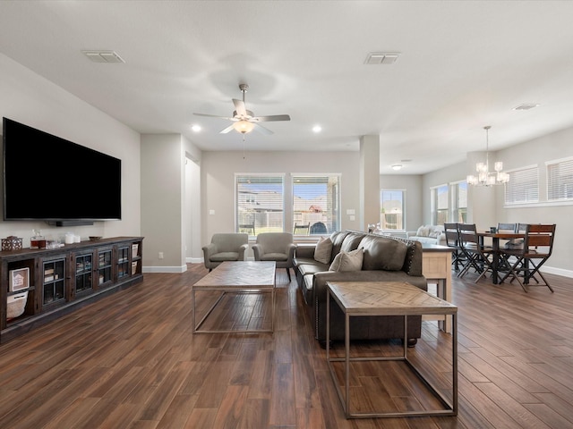 7262 Monarch Dr, Katy, TX 77493 - living room with dark wood-style flooring, ceiling fan with notable chandelier, recessed lighting, baseboards, and visible vents