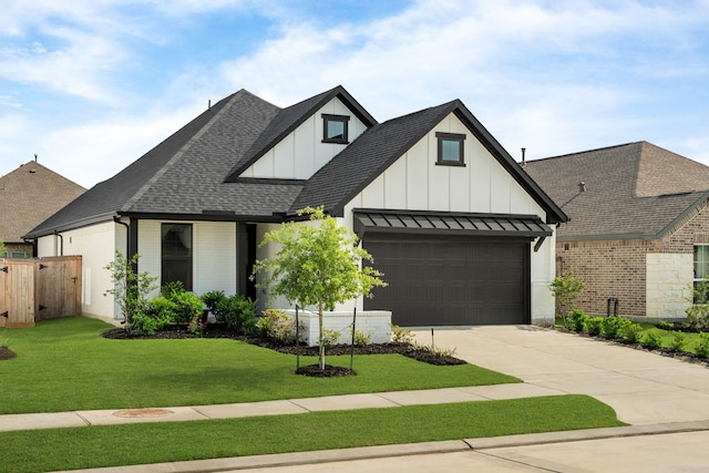 21131 Austin Chalk Dr, Cypress, TX 77433 - view of front facade with board and batten siding, roof with shingles, concrete driveway, and fence