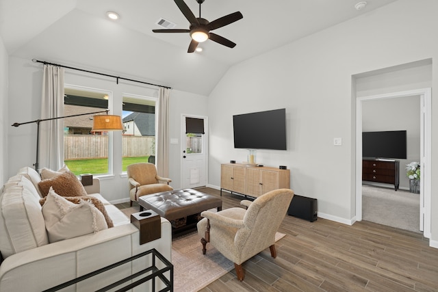 21131 Austin Chalk Dr, Cypress, TX 77433 - living room with lofted ceiling, visible vents, a ceiling fan, and baseboards