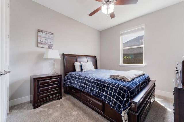bedroom featuring ceiling fan, baseboards, and light colored carpet