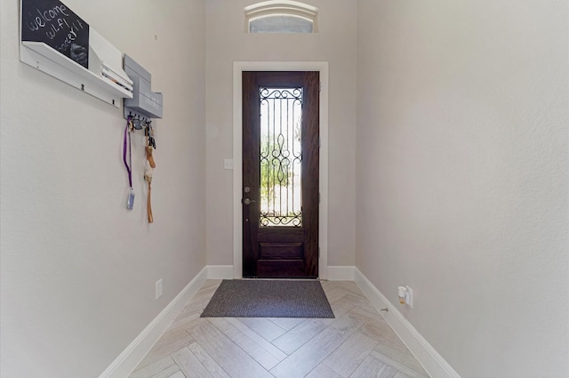 foyer entrance with baseboards