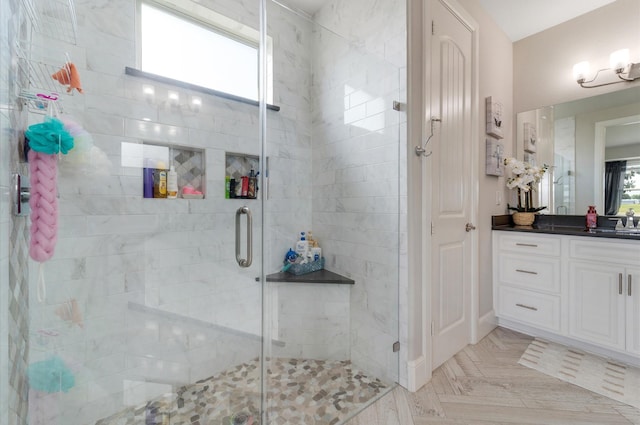 full bathroom with vanity and a stall shower