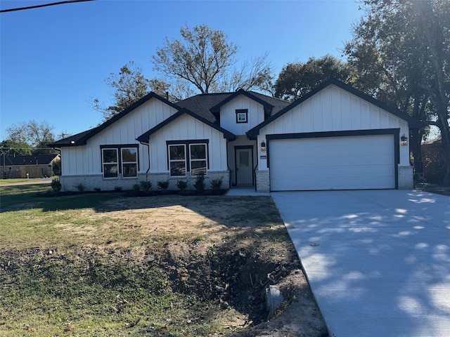 single story home with board and batten siding, concrete driveway, brick siding, and a garage