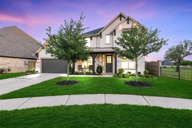 19219 Filly Park Cir, Tomball, TX 77377 - view of front of property featuring concrete driveway, a standing seam roof, a garage, stone siding, and metal roof