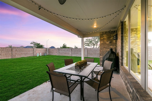 19219 Filly Park Cir, Tomball, TX 77377 - patio terrace at dusk featuring outdoor dining area