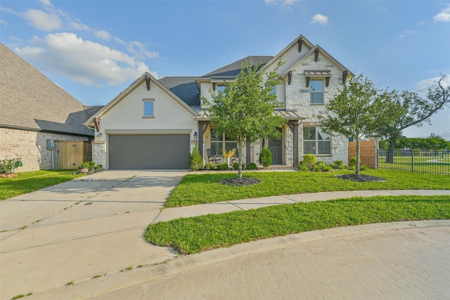19219 Filly Park Cir, Tomball, TX 77377 - view of front of property featuring stone siding, concrete driveway, stucco siding, and an attached garage