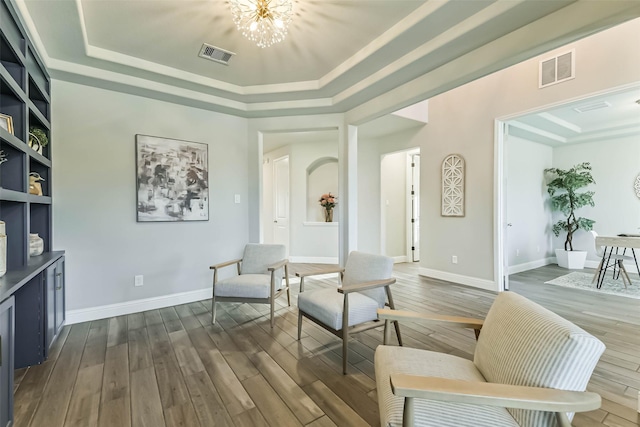 19219 Filly Park Cir, Tomball, TX 77377 - sitting room with a raised ceiling, a chandelier, dark wood finished floors, and baseboards