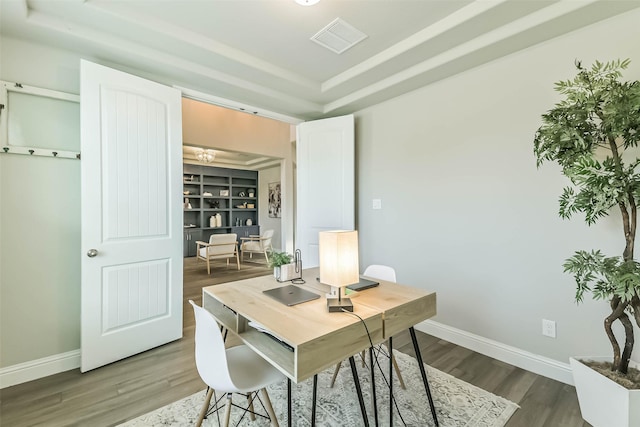 19219 Filly Park Cir, Tomball, TX 77377 - office area featuring a raised ceiling, dark wood-style floors, and baseboards
