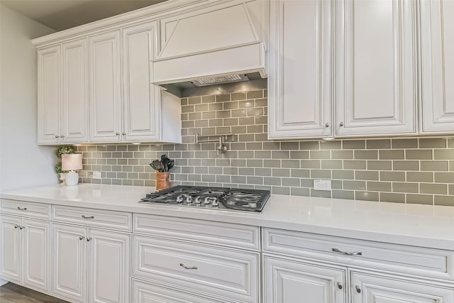 19219 Filly Park Cir, Tomball, TX 77377 - kitchen with stainless steel gas cooktop, white cabinetry, and light countertops