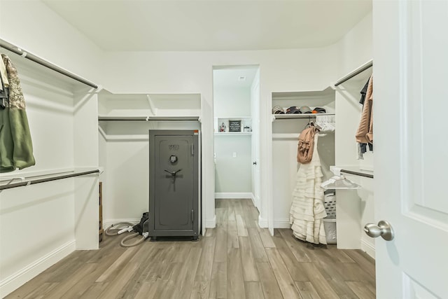 19219 Filly Park Cir, Tomball, TX 77377 - walk in closet featuring wood finished floors