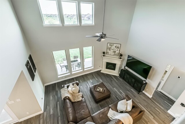19219 Filly Park Cir, Tomball, TX 77377 - living room featuring plenty of natural light, a high ceiling, wood finished floors, and ceiling fan