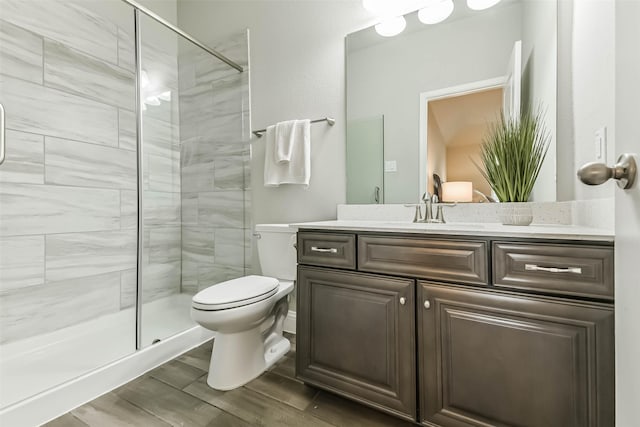 19219 Filly Park Cir, Tomball, TX 77377 - full bathroom featuring a shower stall, toilet, wood finished floors, and vanity