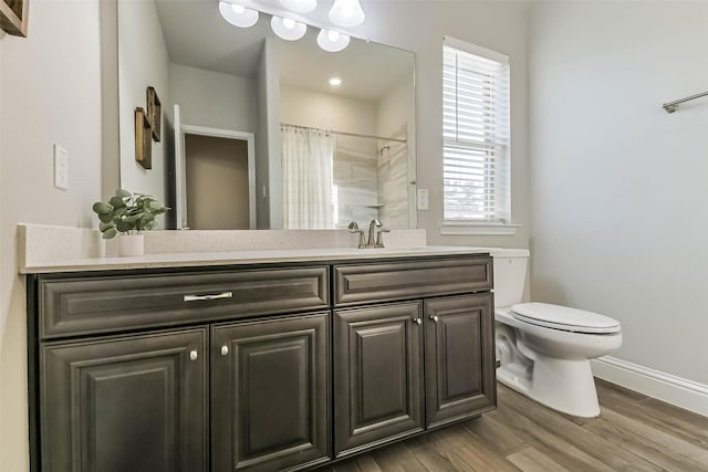 19219 Filly Park Cir, Tomball, TX 77377 - full bathroom featuring toilet, wood finished floors, baseboards, vanity, and a shower with shower curtain