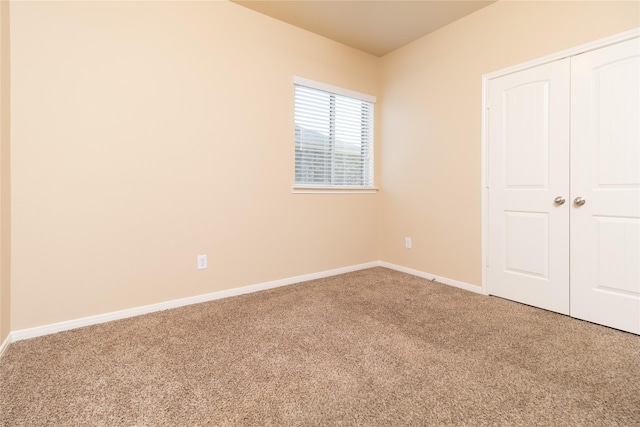 21527 Cotton Valley Ln, Porter, TX 77365 - unfurnished bedroom with baseboards, carpet flooring, and a closet