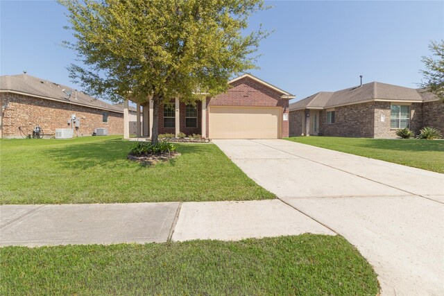 21527 Cotton Valley Ln, Porter, TX 77365 - ranch-style house featuring central AC unit, driveway, an attached garage, a front yard, and brick siding