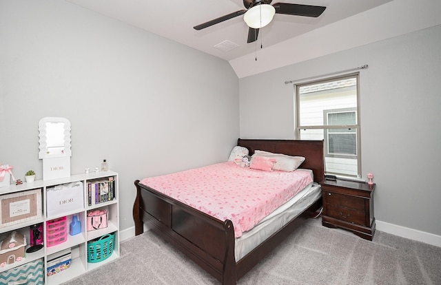 carpeted bedroom featuring visible vents, vaulted ceiling, baseboards, and a ceiling fan