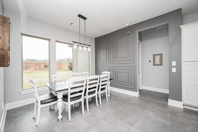 dining room featuring baseboards and visible vents