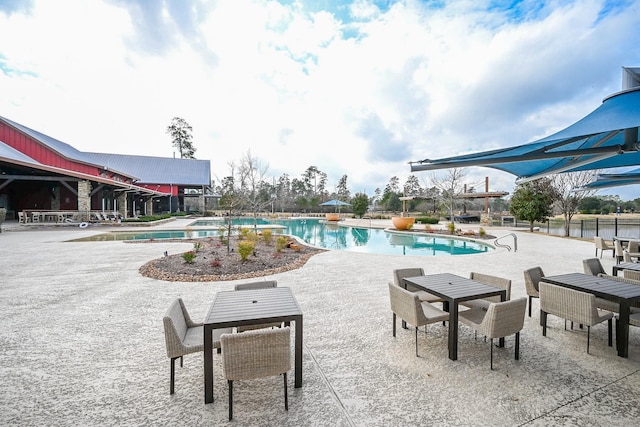 community pool with a patio area