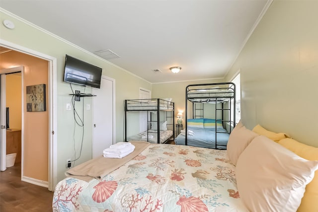 bedroom with baseboards, ornamental molding, access to outside, and visible vents
