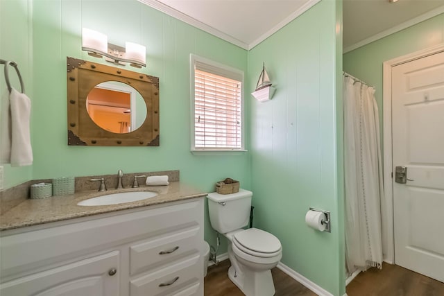 full bath with toilet, ornamental molding, vanity, and wood finished floors