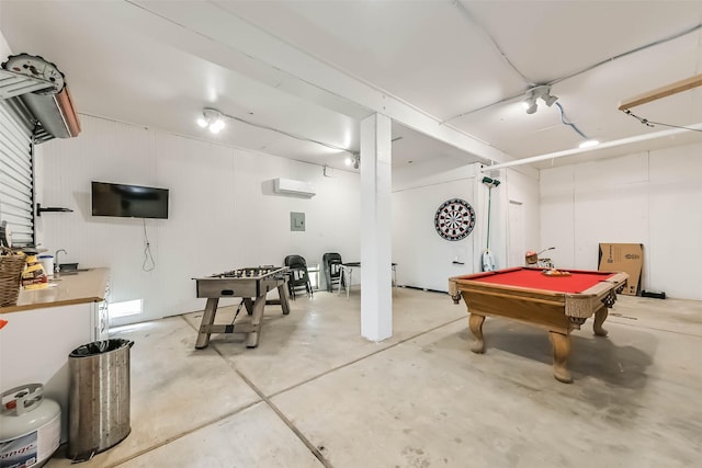 game room featuring concrete flooring, an AC wall unit, and billiards