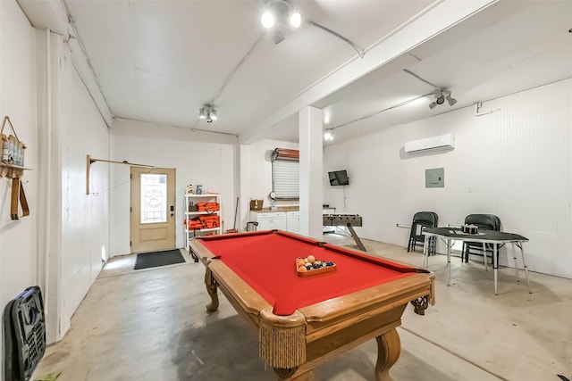 playroom with billiards, heating unit, electric panel, a wall mounted AC, and finished concrete flooring