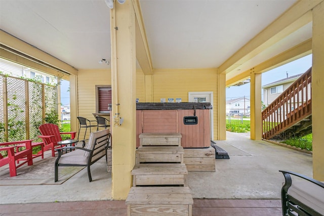 view of patio / terrace with a hot tub