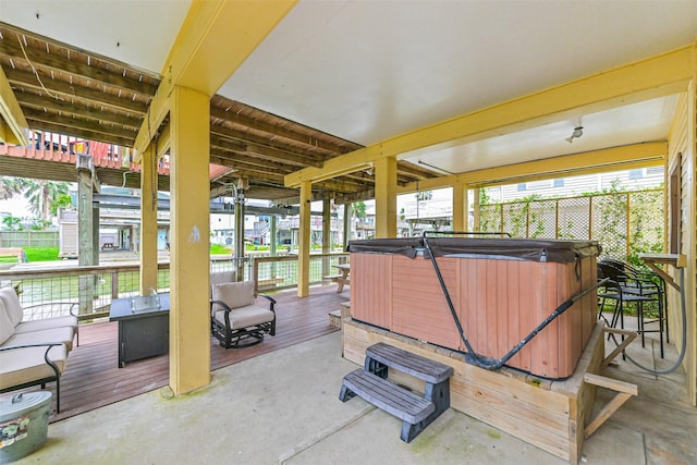 exterior space featuring outdoor lounge area, a hot tub, and a deck