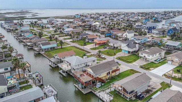 bird's eye view featuring a residential view and a water view