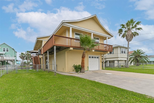 view of front facade with a gate, an attached garage, a front lawn, and driveway