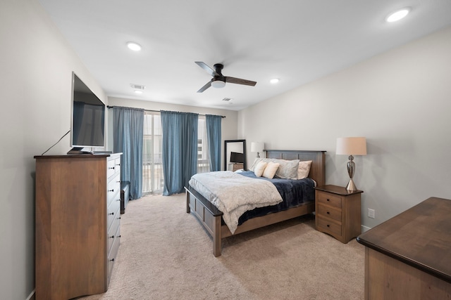 bedroom featuring ceiling fan, recessed lighting, and light colored carpet