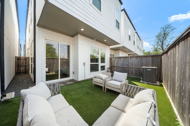 view of patio with an outdoor hangout area, a fenced backyard, and central AC unit