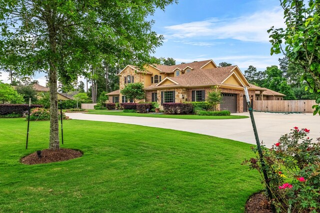 28002 Whispering Maple Way, Spring, TX 77386 - view of front facade featuring brick siding, a garage, driveway, and a shingled roof