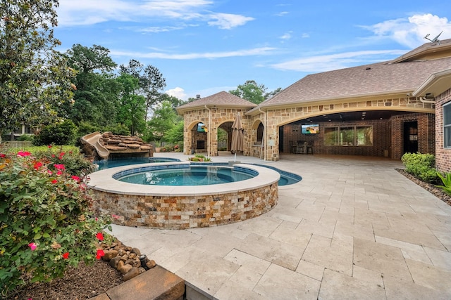 28002 Whispering Maple Way, Spring, TX 77386 - view of swimming pool with a patio area and a pool with connected hot tub