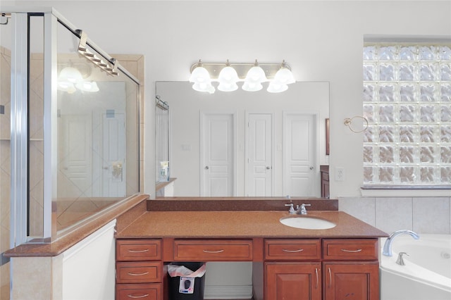 full bathroom with walk in shower, a garden tub, and vanity