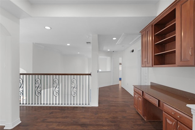 corridor with baseboards, dark wood-style floors, and recessed lighting