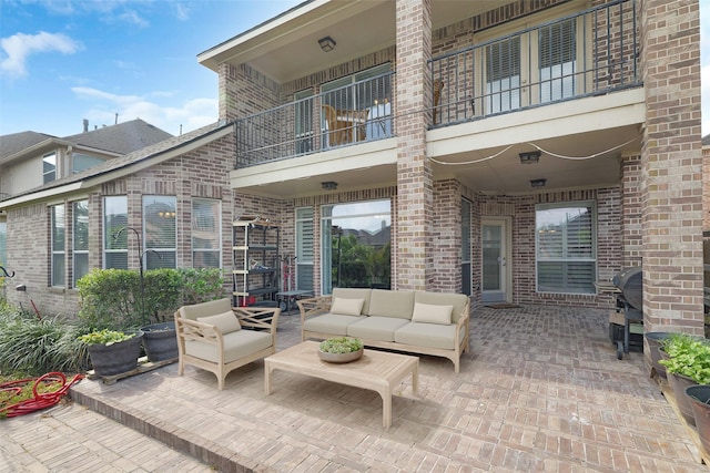 view of patio featuring outdoor lounge area, a balcony, and area for grilling