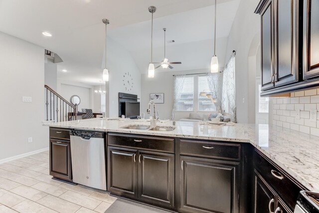 kitchen featuring dishwasher, a sink, a peninsula, tasteful backsplash, and ceiling fan with notable chandelier