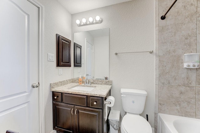 full bathroom with toilet, vanity, and shower / bath combination
