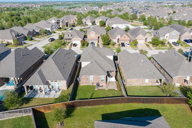 birds eye view of property with a residential view