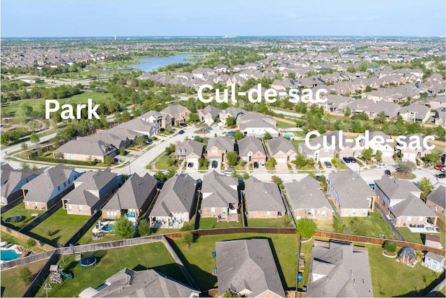 drone / aerial view with a residential view and a water view