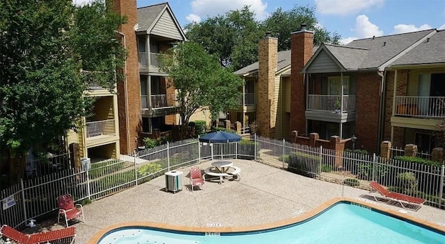 11201 Lynbrook Dr Unit 3703, Houston, TX 77042 - community pool with a patio area and fence