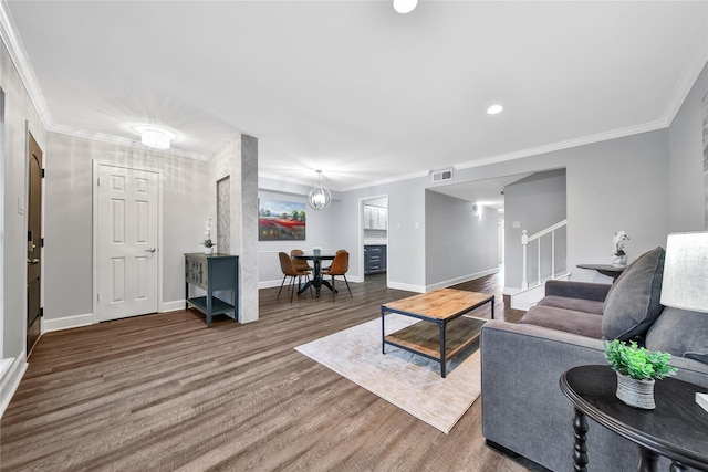818 Wax Myrtle Ln, Houston, TX 77079 - living area with crown molding, stairs, wood finished floors, baseboards, and visible vents