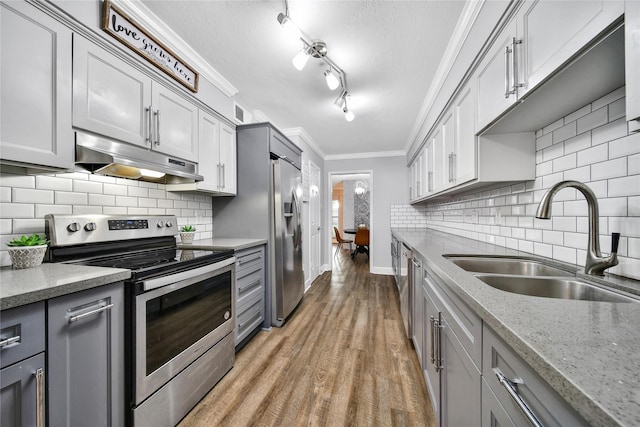 818 Wax Myrtle Ln, Houston, TX 77079 - kitchen with gray cabinets, under cabinet range hood, stainless steel appliances, and a sink