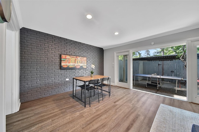 818 Wax Myrtle Ln, Houston, TX 77079 - dining room with brick wall, crown molding, wood finished floors, and recessed lighting