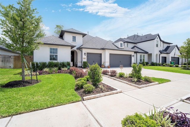 1818 Regent Mill Dr, Missouri City, TX 77459 - view of front of home with concrete driveway, fence, an attached garage, a front yard, and stucco siding