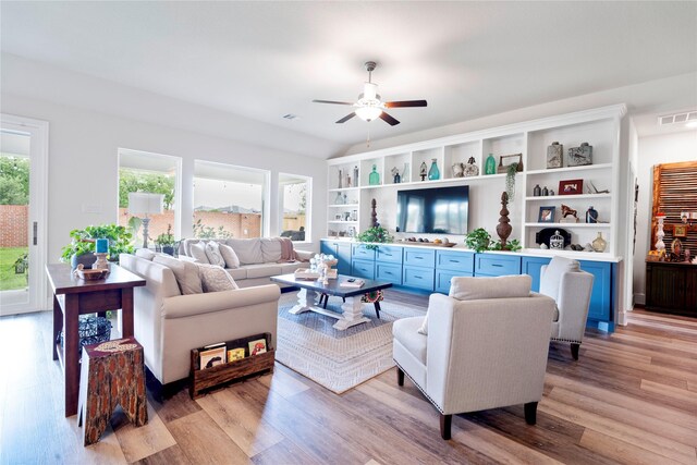 1818 Regent Mill Dr, Missouri City, TX 77459 - living room with light wood-style flooring, visible vents, and ceiling fan
